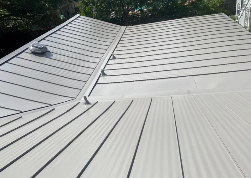 Solar attic fan installed on a metal roof for Roof Ventilation in Park Ridge